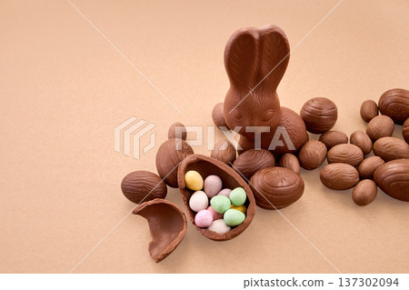 Chocolate easter bunny, eggs, and candy filling Chocolate easter bunny, eggs, and candy filling 137302094