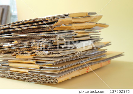 Stack of cardboard pieces on color background. Stack of cardboard pieces on color background. 137302575