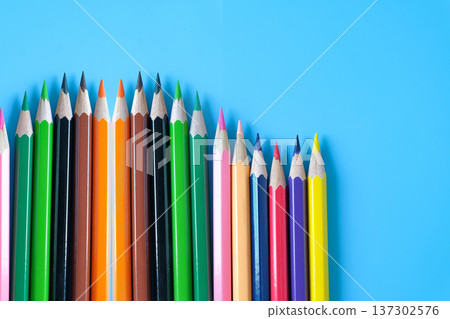 Group of colored pencils on color background. Group of colored pencils on color background. 137302576