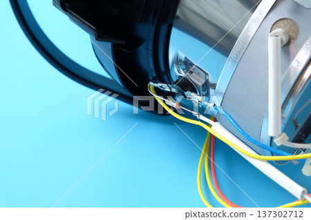 Repairing electric kettle. Repair of burnt or broken household appliances . Repairing electric kettle. Repair of burnt or broken household appliances . 137302712