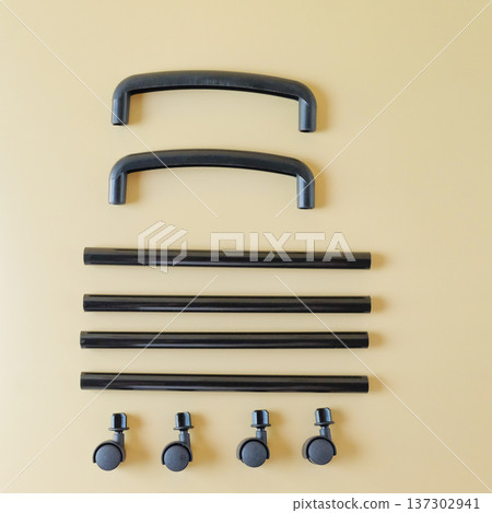 Black Plastic pipe with roller on color background. Black Plastic pipe with roller on color background. 137302941