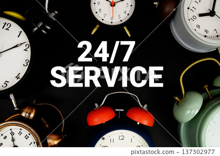 24 hr 7 Day Service text with alarm clock on black background 24 hr 7 Day Service text with alarm clock on black background 137302977