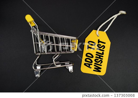 Mini Trolley Shopping Cart and price tag with message "Add To Wishlist" on black background 137303008