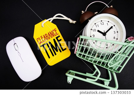 Clearance Time text with price tag, optical mouse, trolly cart and alarm clock on black background, Shopping Online Concept 137303033