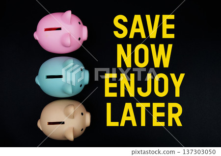 Save Now Enjoy Later text with piggy bank on black background Save Now Enjoy Later text with piggy bank on black background 137303050