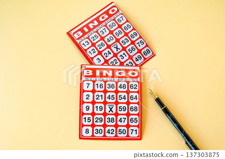 Red Bingo card game on color background. Red Bingo card game on color background. 137303875