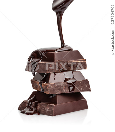 Dark Chocolate Bar Stack with Melted Chocolate Drizzle Isolated on Light Background Dark Chocolate Bar Stack with Melted Chocolate Drizzle Isolated on Light Background 137304702