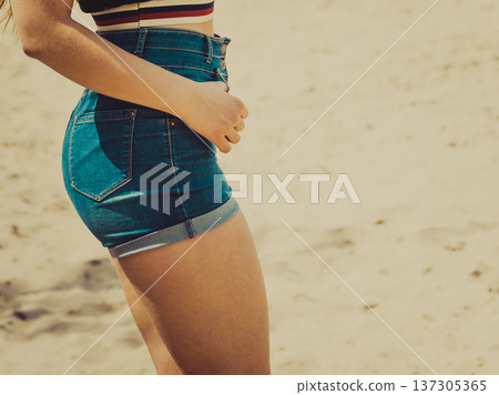 Female buttocks in denim shorts Female buttocks in denim shorts 137305365