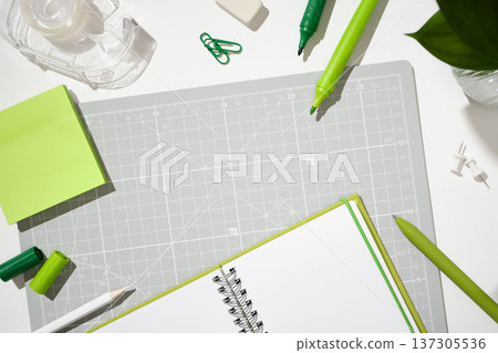 Creative workspace with markers, tape, and sticky notes for planning and projects. Creative workspace with markers, tape, and sticky notes for planning and projects. 137305536