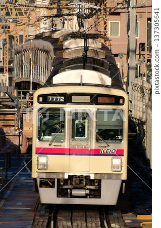 Keio 7000 series 7722F illuminated by the setting sun 137305641