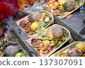 Traditional Hindu offerings for Chhath Puja arranged in bamboo trays with coconut fruits and ritual sweets 137307091