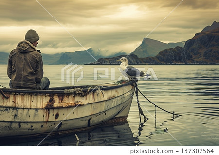 Serene Reflection on the Lake Solitary Fisherman with a Curious Seagull and Majestic Mountain View 137307564