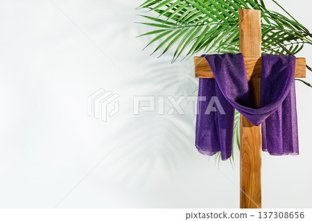 Christian cross draped with purple cloth, palm branch Christian cross draped with purple cloth, palm branch 137308656