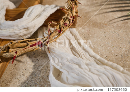 Crown of thorns on cross symbolizing sacrifice and resurrection 137308660
