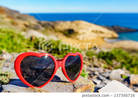 Sunglasses against sea coast 137308716