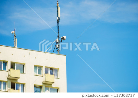 Cellular network antenna against blue sky. Cellular network antenna against blue sky. 137308737