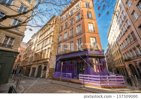 Lyon, france. December 27, 2023. Vieux lyon street with historic buildings and distinctive purple storefront, showing typical european architecture under a clear blue sky Lyon, france. December 27, 2023. Vieux lyon street with historic buildings and distinctive purple storefront, showing typical european architecture under a clear blue sky 137309000