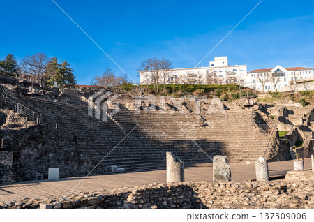 Lyon, france. December 27, 2023. Roman ruins of the ancient fourviere theatre in lyon, france, featuring tiered stone seating under a blue sky, reflecting history and tourism Lyon, france. December 27, 2023. Roman ruins of the ancient fourviere theatre in lyon, france, featuring tiered stone seating under a blue sky, reflecting history and tourism 137309006