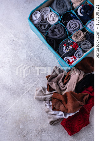 Decluttering concept. Organizing sock storage Decluttering concept. Organizing sock storage 137309521