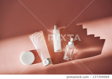Skincare cosmetic products with bottle and tube on pink background Skincare cosmetic products with bottle and tube on pink background 137309989