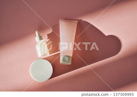Skincare product bottles with dropper, cream jar, soft shadows Skincare product bottles with dropper, cream jar, soft shadows 137309993
