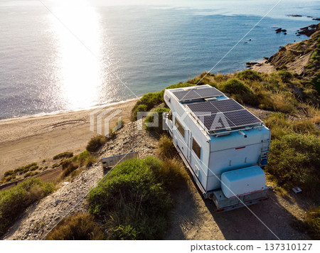 Caravan with solar panels on roof camp on sea, Spain. Aerial view. Caravan with solar panels on roof camp on sea, Spain. Aerial view. 137310127