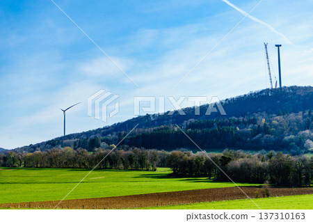 Country landscape with crane at wind turbine Country landscape with crane at wind turbine 137310163
