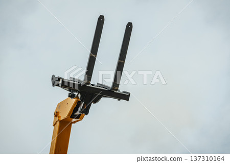 Forklift industrial loader or stacker against sky. Forklift industrial loader or stacker against sky. 137310164