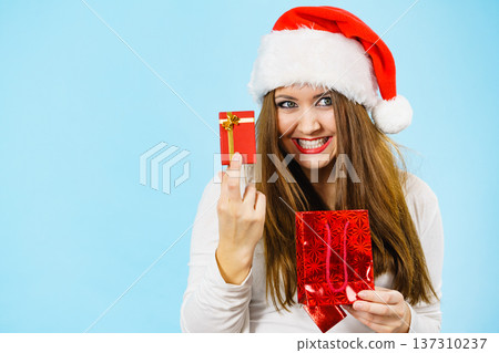 Happy Christmas woman holds red gift box Happy Christmas woman holds red gift box 137310237