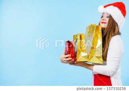 Happy Christmas woman with paper gift bags Happy Christmas woman with paper gift bags 137310256