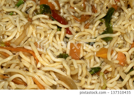 A Close up of delicious fried noodles dinner with vegetables 137310435