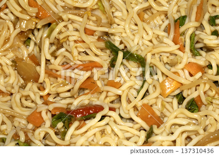 A Close up of delicious fried noodles dinner with vegetables 137310436