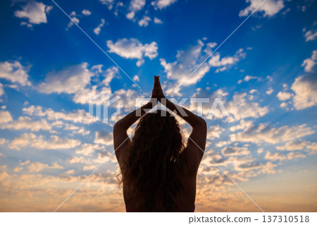 Fit woman jumping at the beach during summer vacation Fit woman jumping at the beach during summer vacation 137310518
