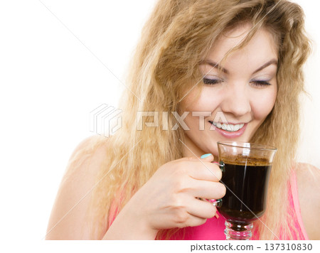 Positive woman drinking her morning coffee 137310830