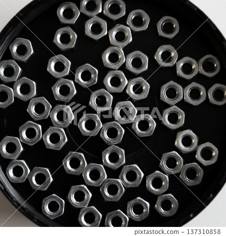 Pattern of nuts lie in black circle tray square stock photo Pattern of nuts lie in black circle tray square stock photo 137310858