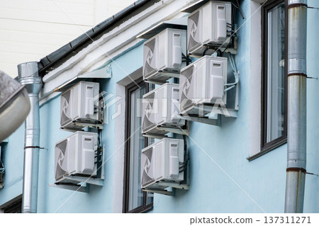 air conditioning on facade of building, air cooling in hot weather.  137311271