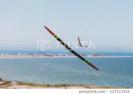RC soaring plane on blue sky 137311435