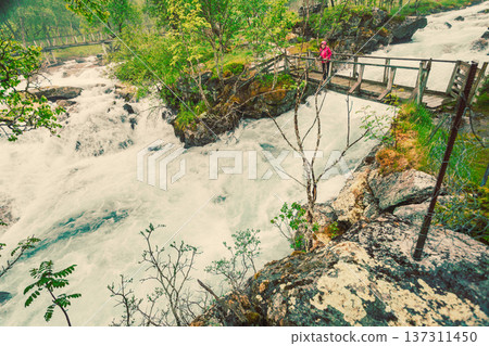 Tourist on river bridge, Norway Tourist on river bridge, Norway 137311450