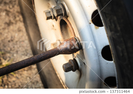 Fixing car tire with rim socket wrench 137311464