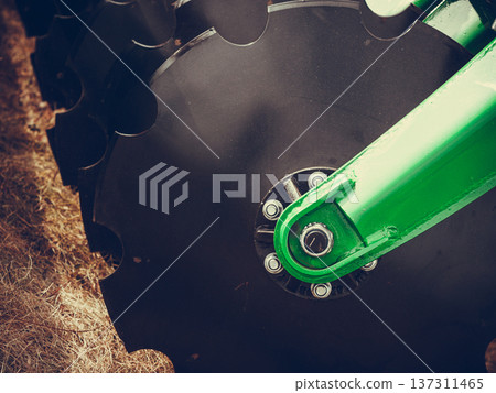 Detailed closeup of disc harrow agricultural machinery Detailed closeup of disc harrow agricultural machinery 137311465