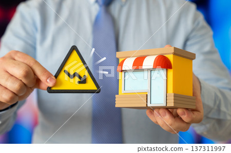 A businessman notes business losses. Economic recession and small business decline with financial stress revenue drop and survival strategy. 137311997