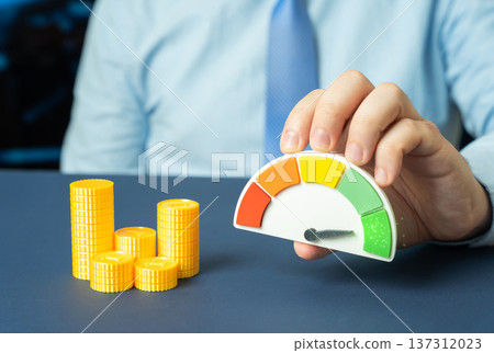 Money and a performance scale showing green. High liquidity and sufficient funds for purchase goals with positive account balance and financial stability. Money and a performance scale showing green. High liquidity and sufficient funds for purchase goals with positive account balance and financial stability. 137312023