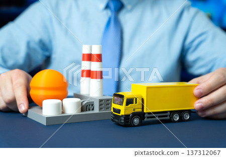 A businessman organizes the transportation of products and raw materials to an industrial plant. Industrial logistics supply chain coordination and procurement management for efficient production. A businessman organizes the transportation of products and raw materials to an industrial plant. Industrial logistics supply chain coordination and procurement management for efficient production. 137312067