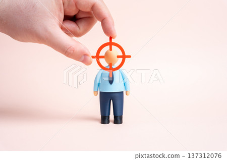 An office worker in the center of the targeting circle. Headhunting and recruiting specialists in high demand professions amid talent shortage and competitive labor market trends. 137312076