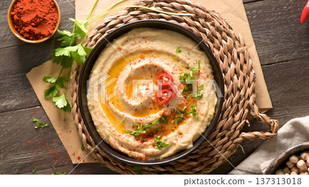 Delicious hummus in ceramic bowl 137313018