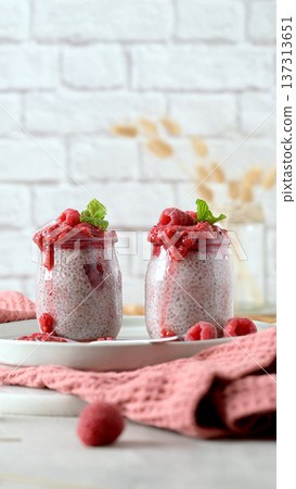 Chia seed pudding with fresh raspberry coulis Chia seed pudding with fresh raspberry coulis 137313651