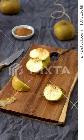 Golden Apples and Cinnamon on a Rustic Table Golden Apples and Cinnamon on a Rustic Table 137313669