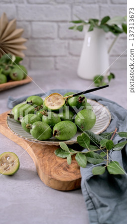 Fresh Feijoa Fruit Display on a Rustic Surface Fresh Feijoa Fruit Display on a Rustic Surface 137313673