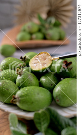 Fresh Feijoa Fruit Close-up with a Golden Spoon 137313674