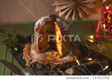 Sliced Panettone Cake with Sugar Dusting on Rustic Wood Sliced Panettone Cake with Sugar Dusting on Rustic Wood 137313758